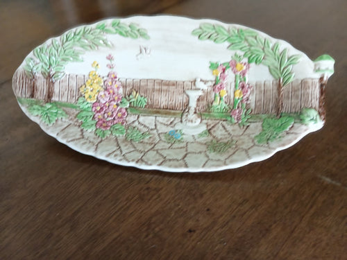 Vintage English ceramic leaf dish with cottage garden scene in pastel colours